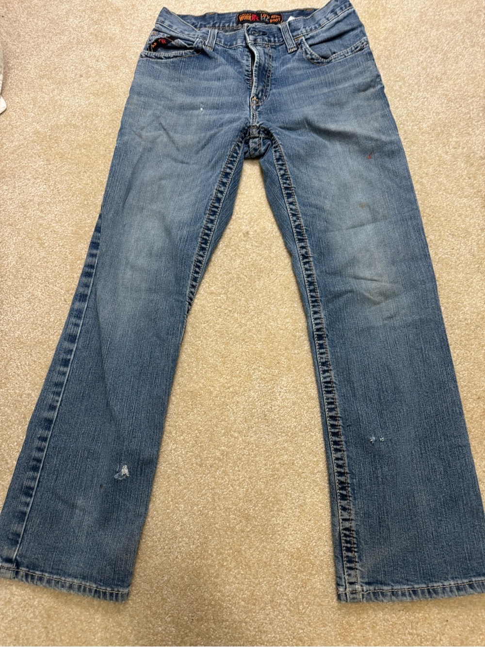 Ariat Men's low rise Bootcut Jeans in Medium Blue Denim fire rated. 30x30